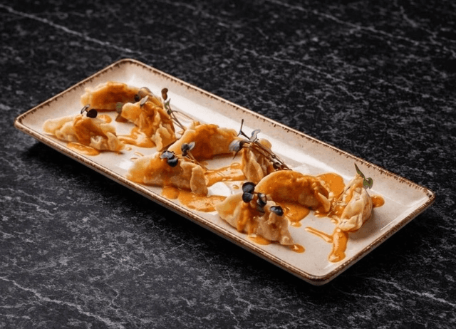 Handmade Salmon Ravioli in Creamy Tomato Sauce